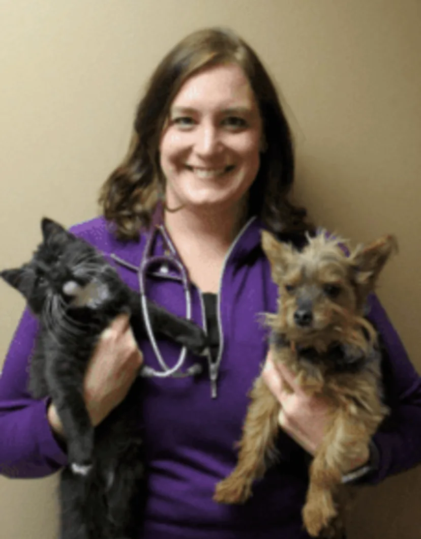 Dr. Jaleen Brunner-Flitz holding a cat and a dog